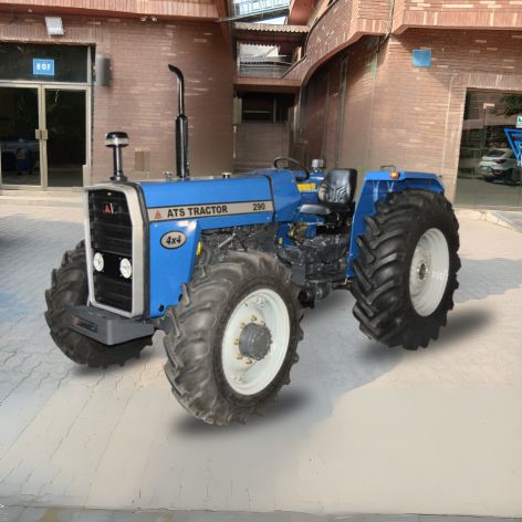 ATS Tractor 290 4x4 - Blue four-wheel drive tractor displayed in modern industrial courtyard with brick building backdrop